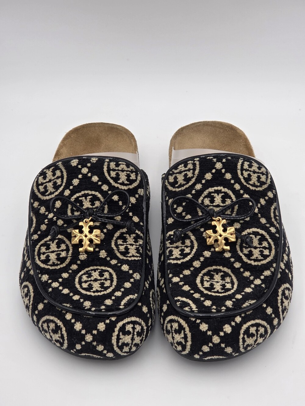 Tory Burch T Monogram Jacquard Charm Mules in black.
